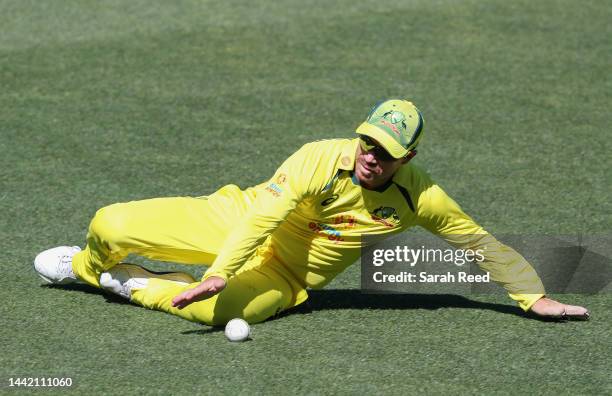 David Warner of Australia prevents 4 runs during game one of the One Day International series between Australia and England at Adelaide Oval on...