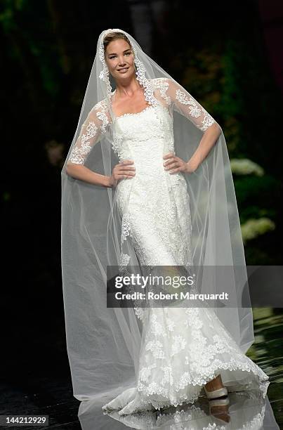 Model walks the runway for the latest Pronovias Fashion collection at the Museu Nacional d’Art de Catalunya on May 11, 2012 in Barcelona, Spain.