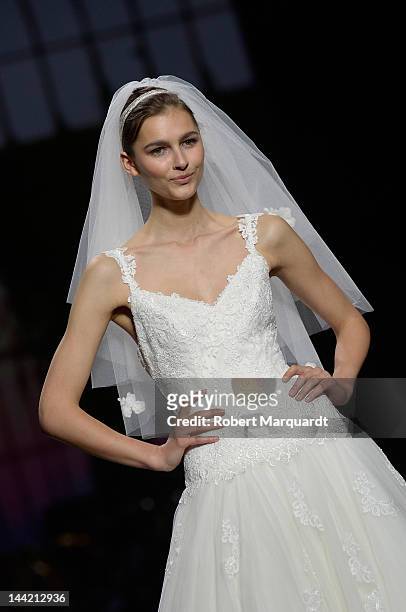 Model walks the runway for the latest Pronovias Fashion collection at the Museu Nacional d’Art de Catalunya on May 11, 2012 in Barcelona, Spain.