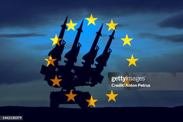 anti-aircraft missile system on the background of the eu flag - nuclear weapon stock pictures, royalty-free photos & images