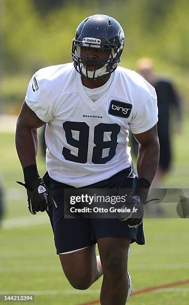 Defensive end Greg Scruggs of the Seattle Seahawks warms up during minicamp at the Virginia Mason Athletic Center on May 11, 2012 in Renton,...