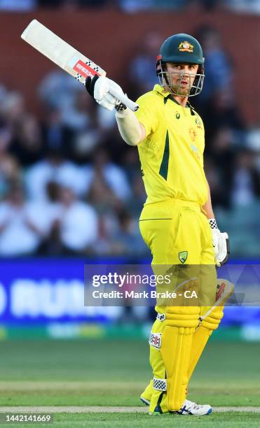 Travis Head of Australia celebrates making his half century during game one of the One Day International series between Australia and England at...