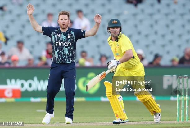 Liam Dawson of England reacts as Travis Head of Australia runs during game one of the One Day International series between Australia and England at...