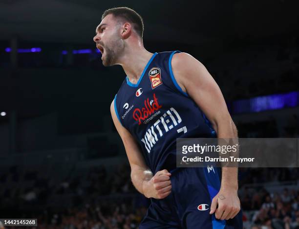 Isaac Humphries of Melbourne United reacts after dunking the ball during the round 7 NBL match between Melbourne United and Adelaide 36ers at John...
