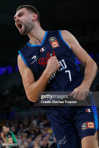 Isaac Humphries of Melbourne United reacts after dunking the ball during the round 7 NBL match between Melbourne United and Adelaide 36ers at John...