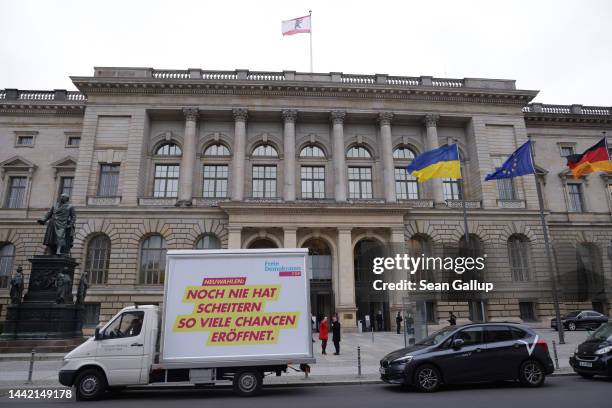 Billboard of the German Free Democrats reads: "Never has failure opened so many chances" as it stands outside the Berlin state parliament on November...