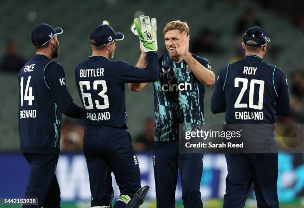 David Willey of England and Jos Buttler of England celebrate with team mates James Vince and Jason Roy the wicket of Marnus Labuschagne of Australia....