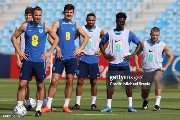 England captain Harry Kane alongside John Stones, Harry Maguire , Callum Wilson, Bukayo Sako and Eric Dier during the England Press Conference at Al...