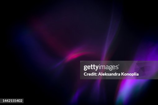 Colorful neon rainbow aurora borealis or laser light leaks texture on black background Colorful neon rainbow aurora borealis or laser light leaks texture on black background