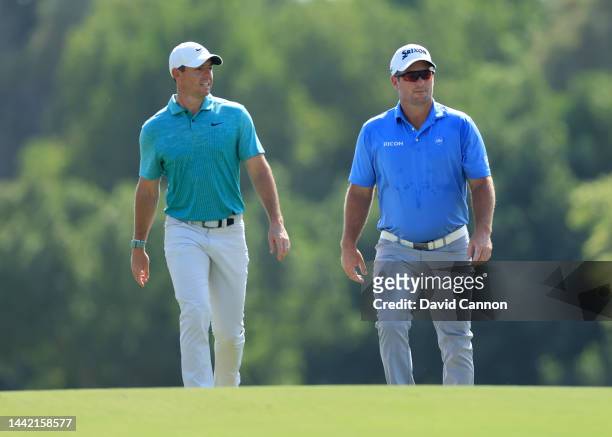 Ryan Fox of New Zealand and Rory McIlroy of Northern Ireland walk to their second shots on the third hole during the first round of the DP World Tour...