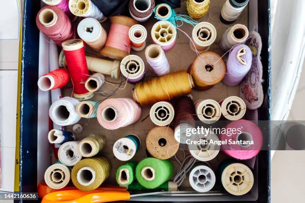 colorful sewing threads in a box - spool thread stock pictures, royalty-free photos & images