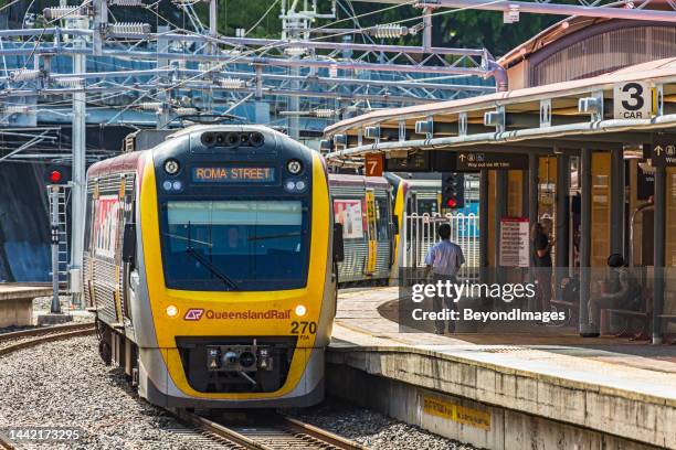 queensland rail electric train arriving at brisbane's roma street station - queensland rail stock pictures, royalty-free photos & images