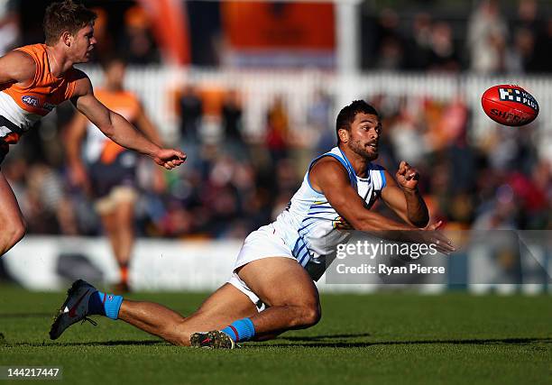 Karmichael Hunt of the Suns handballs during the round seven AFL match between the Greater Western Sydney Giants and the Gold Coast Suns at Manuka...