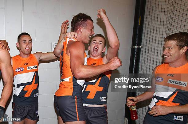 The Giants celebrate their first AFL victory after the round seven AFL match between the Greater Western Sydney Giants and the Gold Coast Suns at...