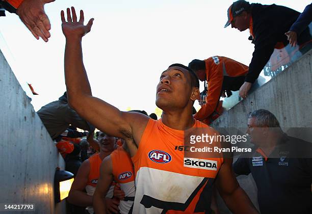Israel Folau of the Giants celebrates the Giant first AFL victory after the round seven AFL match between the Greater Western Sydney Giants and the...