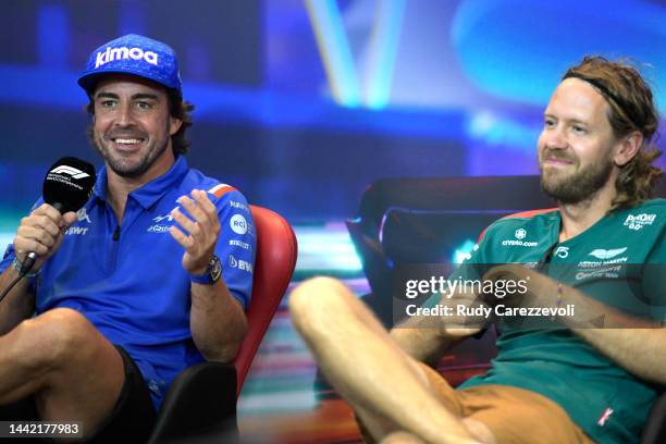 Fernando Alonso of Spain and Alpine F1 and Sebastian Vettel of Germany and Aston Martin F1 Team talk in a press conference during previews ahead of...