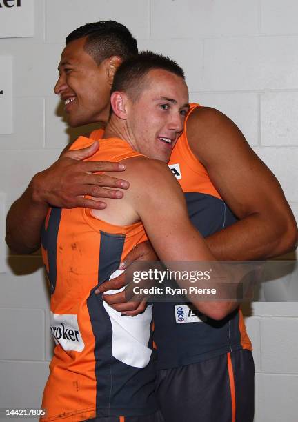 Israel Folau and Tom Scully of the Giants celebrates the Giants first AFL victory after the round seven AFL match between the Greater Western Sydney...