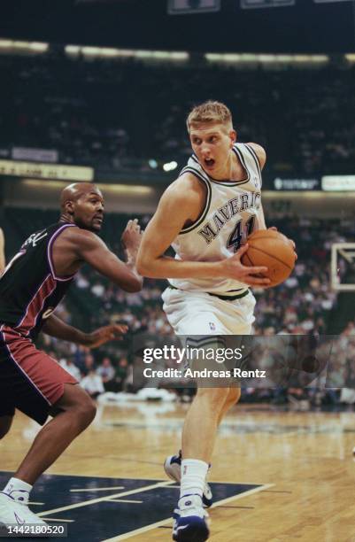 American basketball player Bryon Russell, of Utah Jazz, and German basketball player Dirk Nowitzki of the Dallas Mavericks in action during the NBA...