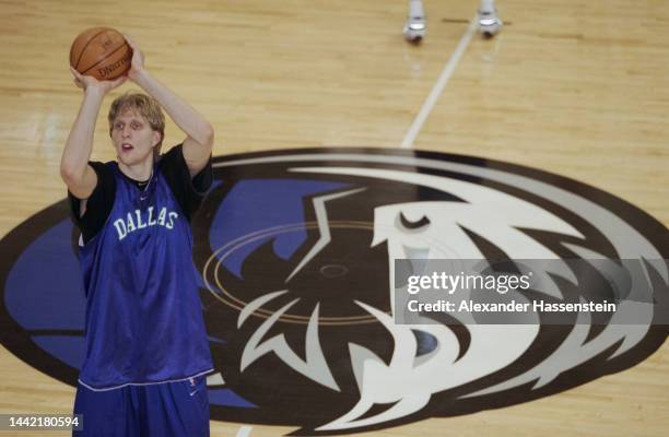 German basketball player Dirk Nowitzki holding a Spalding basketball during a Dallas Mavericks training session at the Reunion Arena in Dallas,...