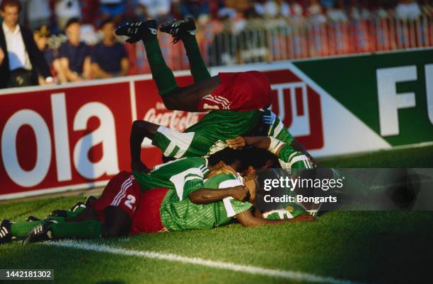 Cameroon players celebrate Roger Milla's second goal during the Round of 16 match, between Cameroon and Colombia, at the 1990 FIFA World Cup, held at...