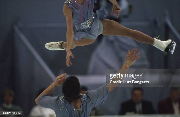 Russian figure skater Elena Berezhnaya and her dance partner, Russian figure skater Anton Sikharulidze, competing for Latvia in the pair skating...
