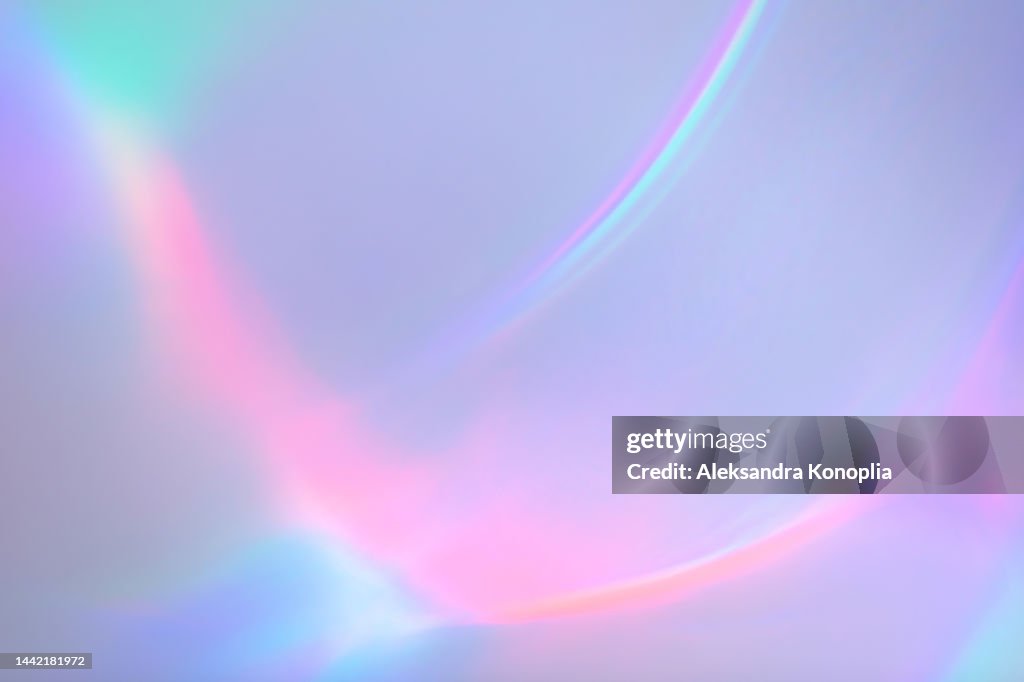Surreal aura rainbow laser light refraction texture overlay effect on white wall
