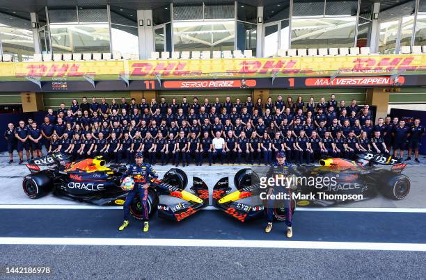 Max Verstappen of the Netherlands and Oracle Red Bull Racing and Sergio Perez of Mexico and Oracle Red Bull Racing pose with the Red Bull Racing team...