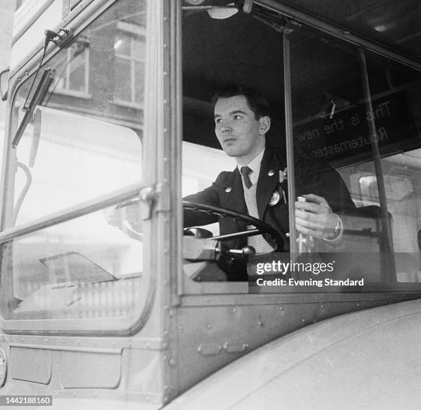 Driver in the cab of a London Transport Routemaster bus operating on the number 143 bus route in London, 31st July 1961.