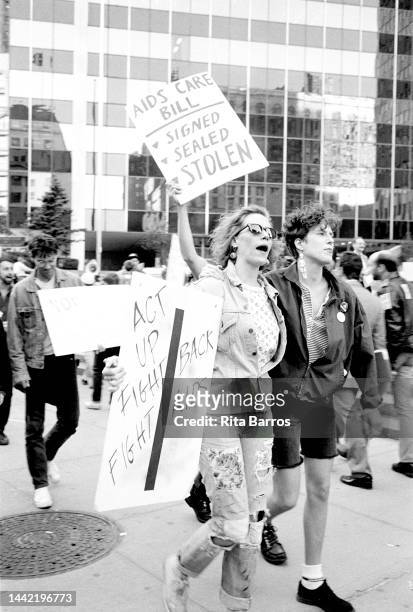Demonstrators, many with signs, participate in an event organized by ACT UP , in Foley Square , New York, New York, October 16, 1990. Among the...