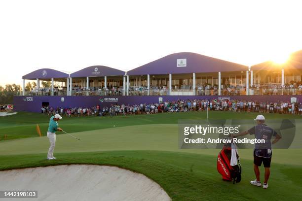 Rory McIlroy of Northen Irleand plays his third shot on the 18th hole during Day One of the DP World Tour Championship on the Earth Course at...