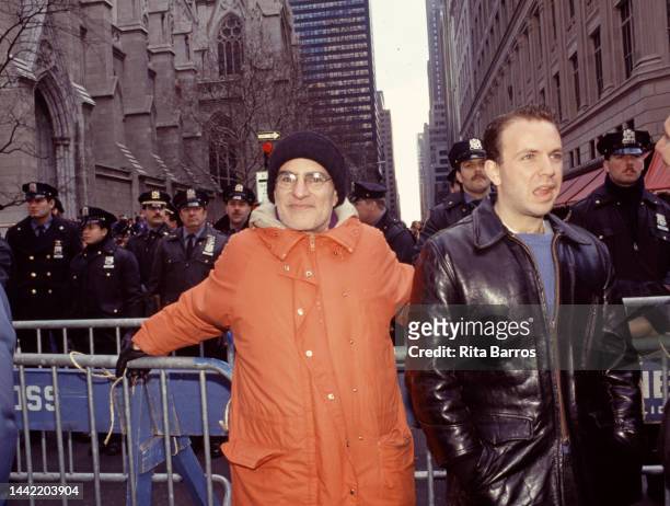 American playwright and activist Larry Kramer leans against a police barricade during an ACT UP protest in front of St Patrick's Cathedral, New York,...