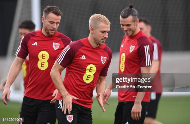 Wales captain Gareth Bale with Aaron Ramsey and Chris Gunter during the Wales Training Session at Al Sad Sports Club on November 17, 2022 in Doha,...