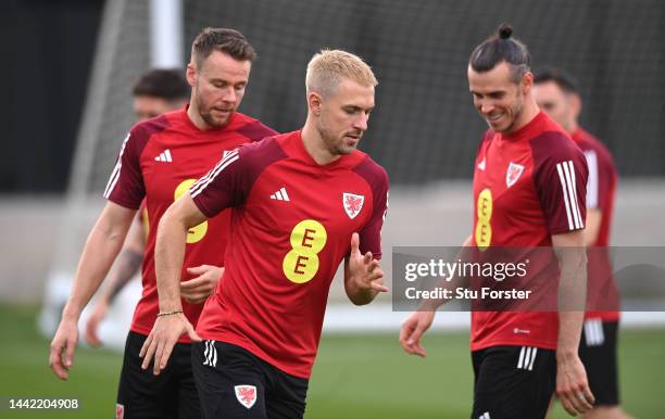 Wales captain Gareth Bale with Aaron Ramsey and Chris Gunter during the Wales Training Session at Al Sad Sports Club on November 17, 2022 in Doha,...