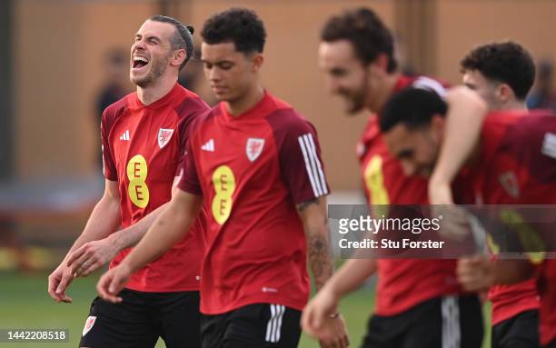 Wales captain Gareth Bale shares a joke with team mates during the Wales Training Session at Al Sad Sports Club on November 17, 2022 in Doha, Qatar.