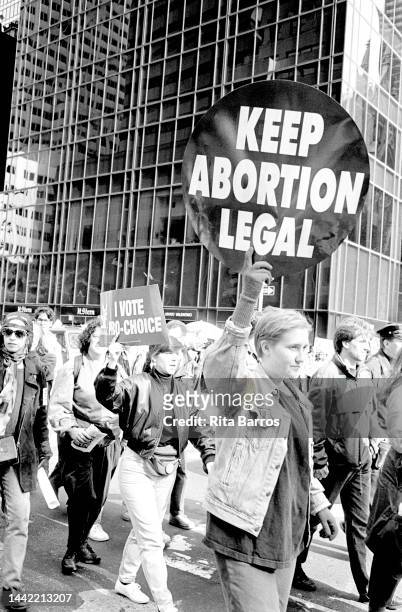 View of a demonstrators, several with signs, during a protest against Operation Rescue , organized by WHAM , New York, New York, October 18, 1992....