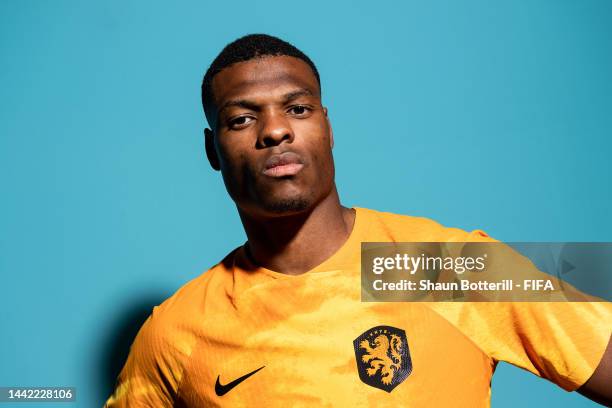 Denzel Dumfries of Netherlands poses during the official FIFA World Cup Qatar 2022 portrait session at on November 16, 2022 in Doha, Qatar.