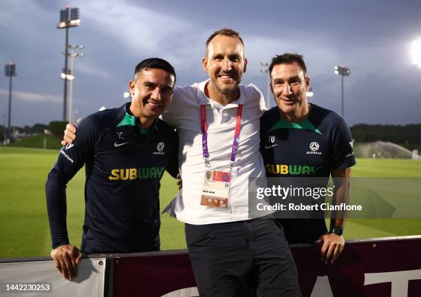 Former Socceroos Tim Cahill and Tony Vidmar pose with former team mate Mark Schwarzer during the Australia training session at the Aspire Training...