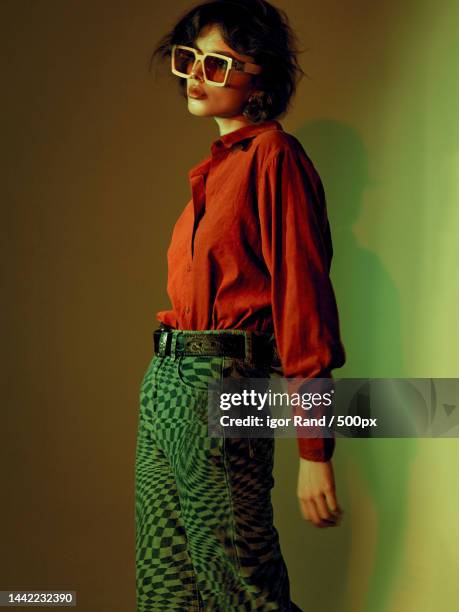young woman wearing sunglasses,china - editorial fotografías e imágenes de stock