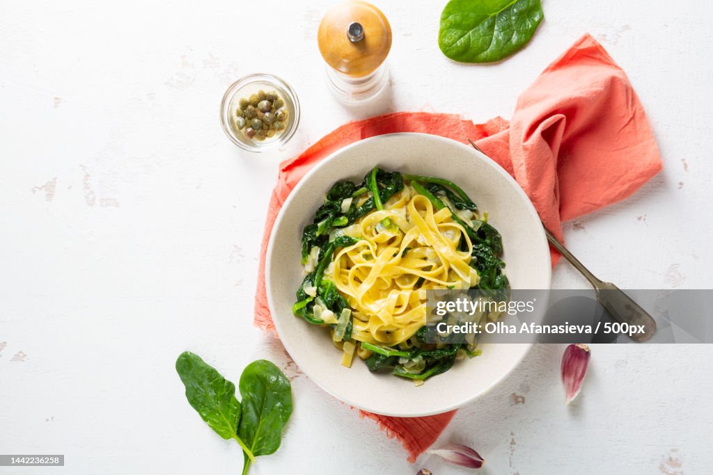 Spinach vegan pasta in white plate,Ukraine