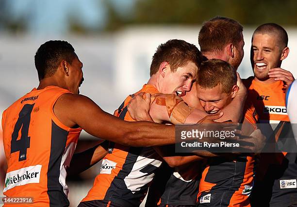Jacob Townsend and Adam Treloar of the Giants celebrate a goal during the round seven AFL match between the Greater Western Sydney Giants and the...