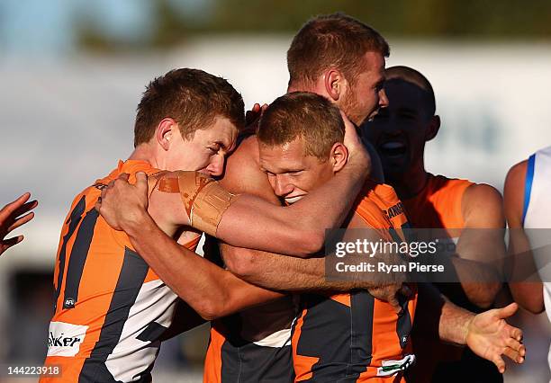 Jacob Townsend and Adam Treloar of the Giants celebrate a goal during the round seven AFL match between the Greater Western Sydney Giants and the...