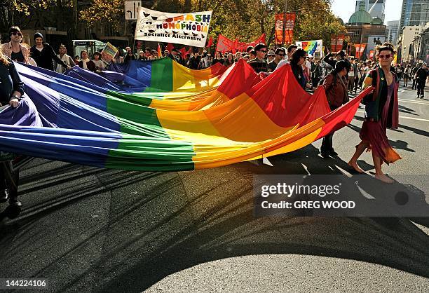 Participants in a pro-marriage equality rally march through the streets of Sydney on May 12, 2012. Australian Attorney-General Nicola Roxon said May...