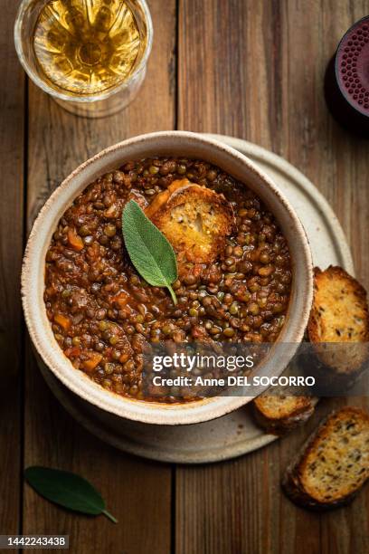 lentil soup with tomato carrots and sage herbs - lentil stock pictures, royalty-free photos & images