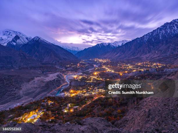 night cityscape long exposure of duikar village is the highest village in hunza valley at gilgit-baltistan province of pakistan. - hunza valley stock-fotos und bilder