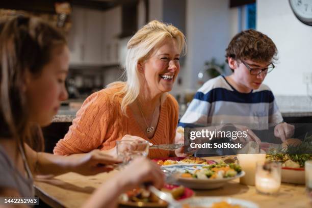my favourite time of year with my favourite people - christmas eating funny stock pictures, royalty-free photos & images