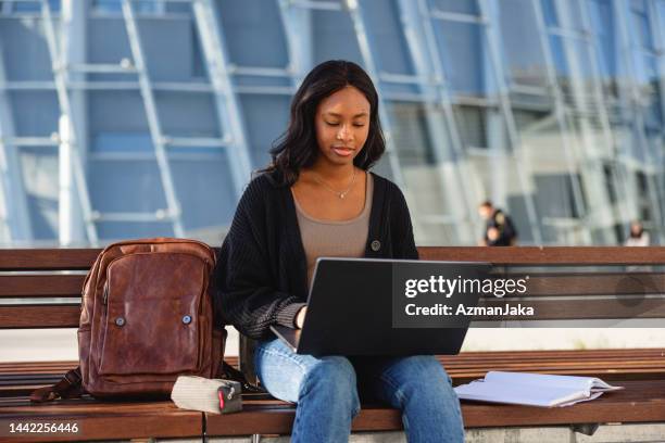 dark-skinned latin-american young college student using her laptop - international student day stock pictures, royalty-free photos & images