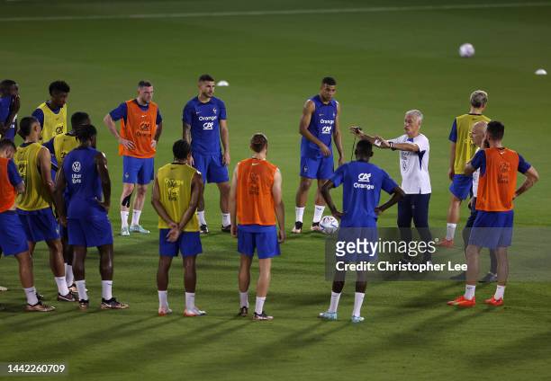 Didier Deschamps, Head Coach of France, talks to his players during the France Press Conference and Training session at Al Sadd SC Stadium on...