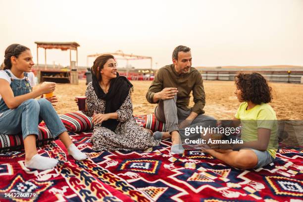 middle eastern having authentic picnic in the desert in dubai - middle eastern food stockfoto's en -beelden