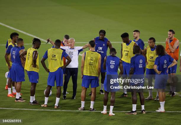 Didier Deschamps, Head Coach of France, talks to his players during the France Press Conference and Training session at Al Sadd SC Stadium on...