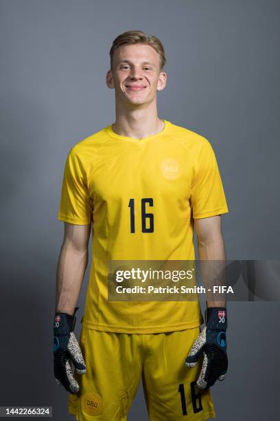 Oliver Christensen of Denmark poses during the official FIFA World Cup Qatar 2022 portrait session on November 17, 2022 in Doha, Qatar.